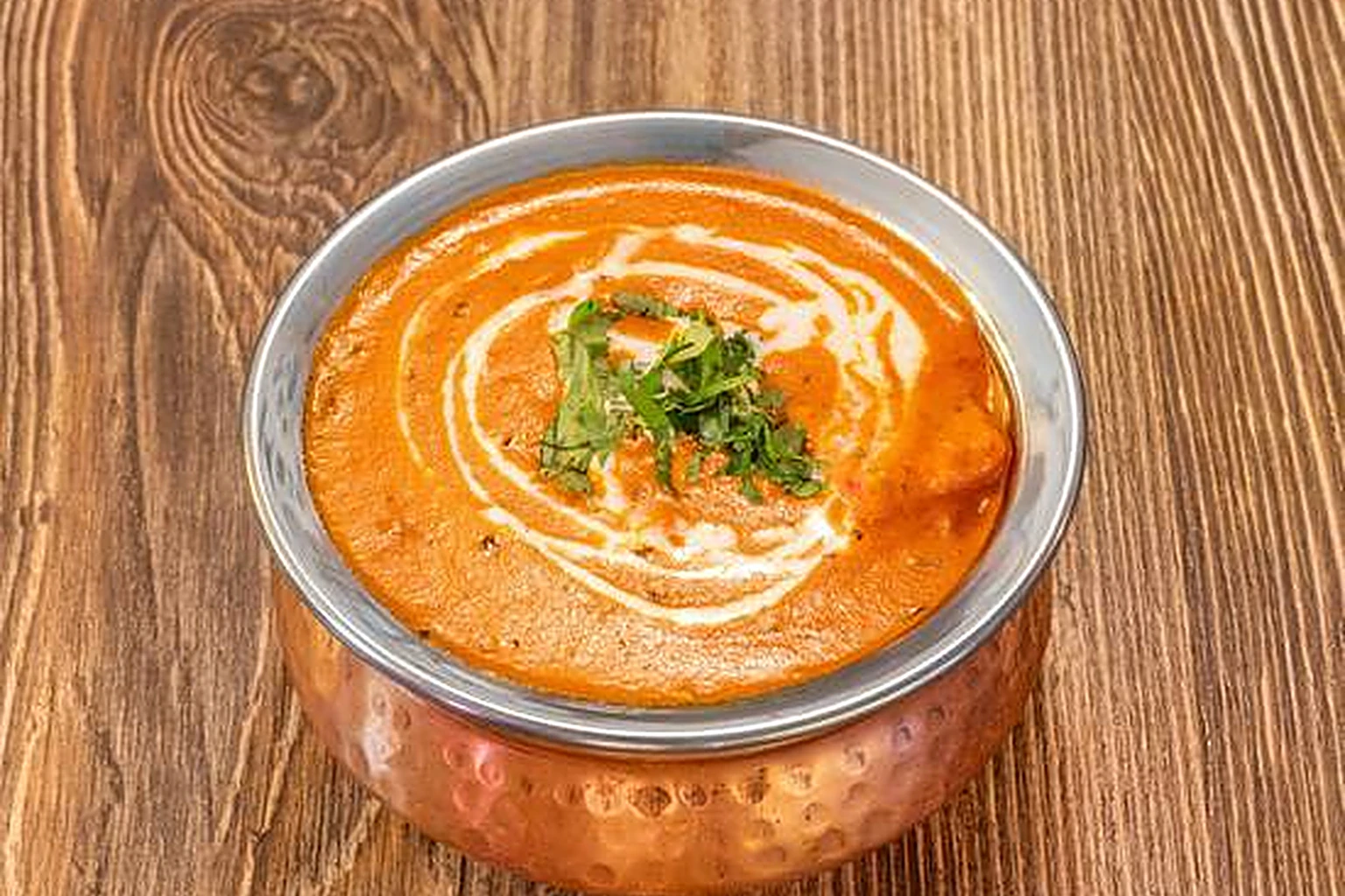 Butter chicken at Saffron Indian Bistro in Banff, Alberta — chicken in a creamy tomato and fenugreek sauce